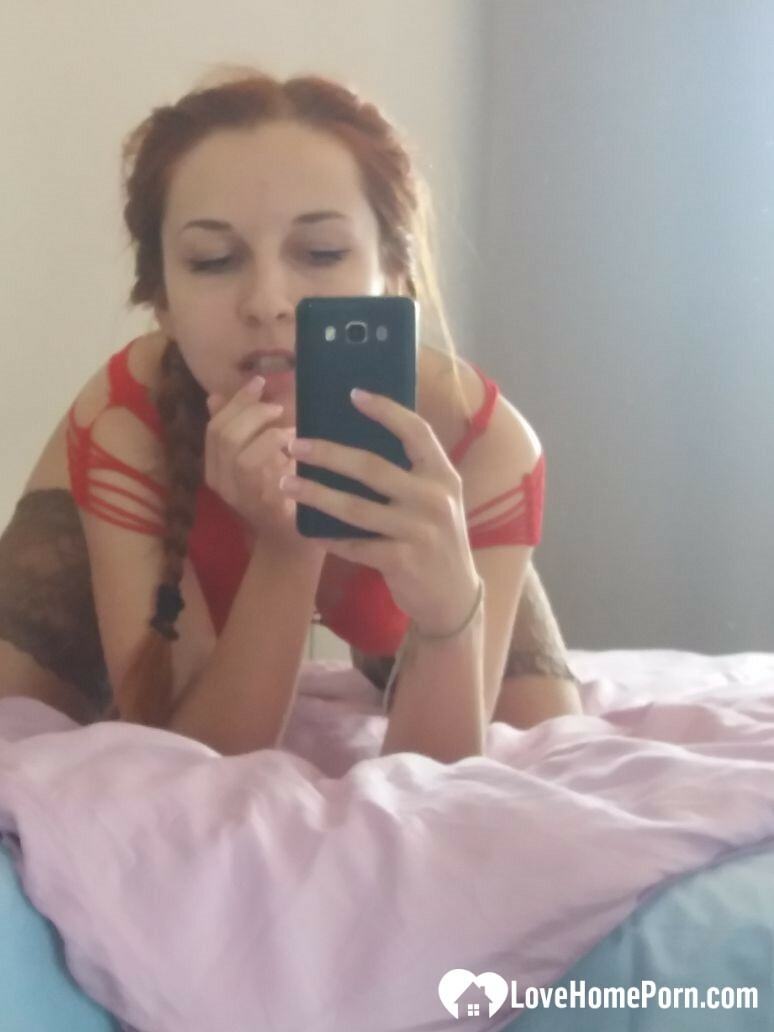 Smoking redhead teases in stockings in the bedroom — 54