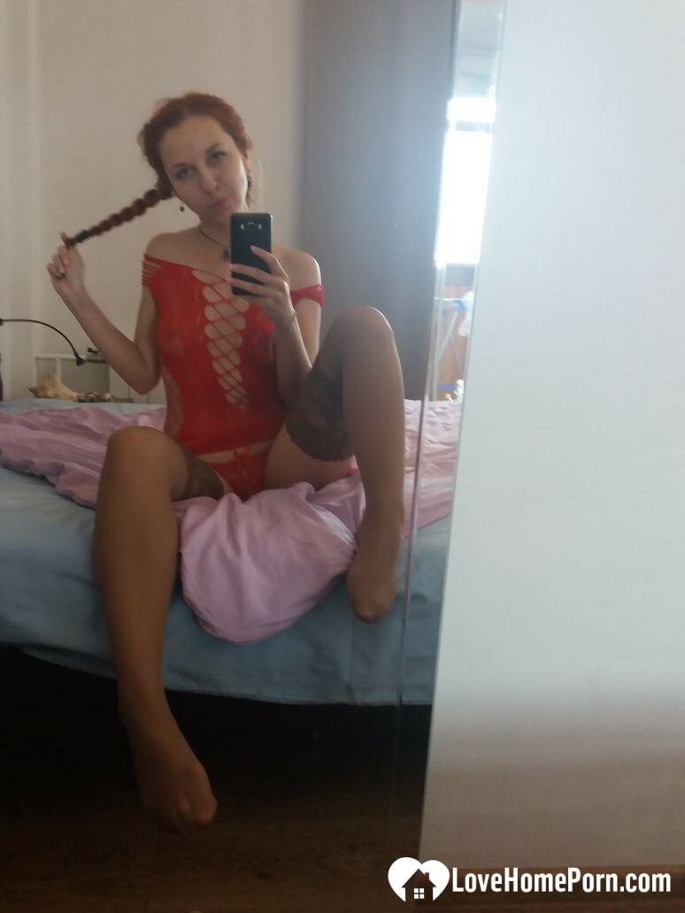 Smoking redhead teases in stockings in the bedroom — 26